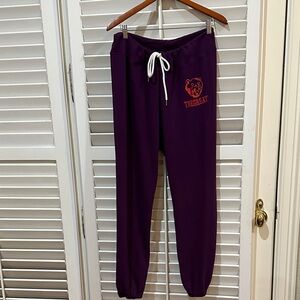 THE GREAT Dark Purple Joggers with Orange Logo.Size Medium